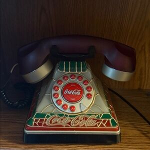Old-fashioned Coca-Cola phone with stained glass theme
